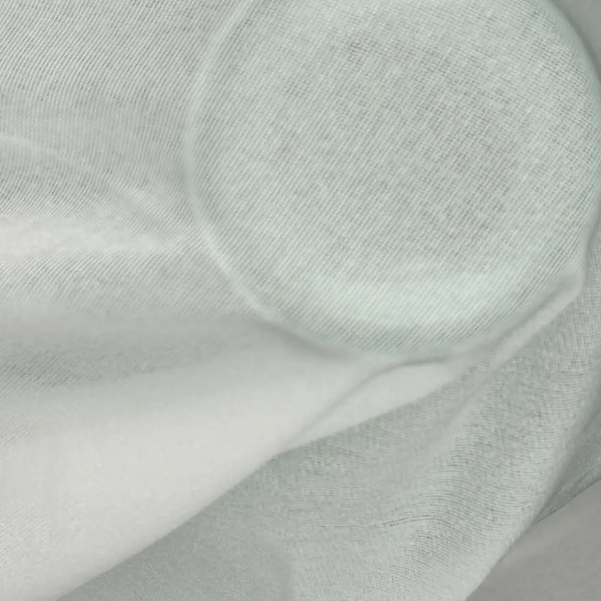 Thermocollant Transparent Blanc Tricoté insertion de trame 24 g/m² - Lainière Paris