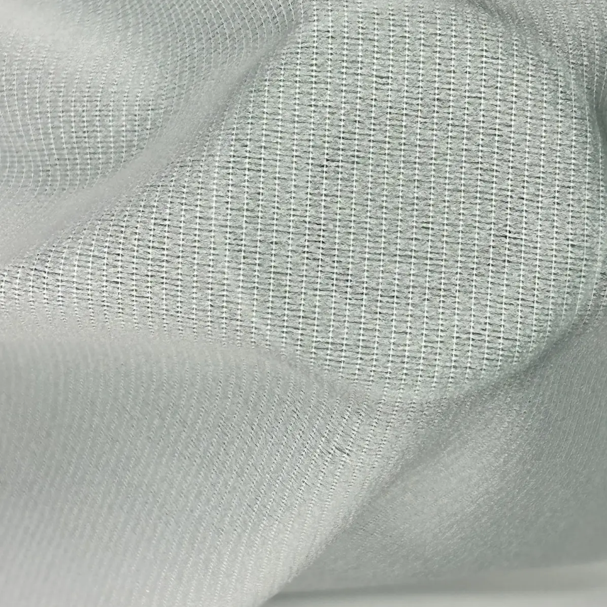 Fusible interfacing Semi-transparent White Warp knit weft inserted 47 g/m² - Lainière Paris