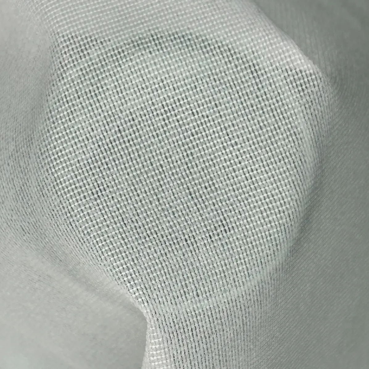 Fusible interfacing Semi-transparent White Warp knit weft inserted 66 g/m² - DHJ, Lainière Paris